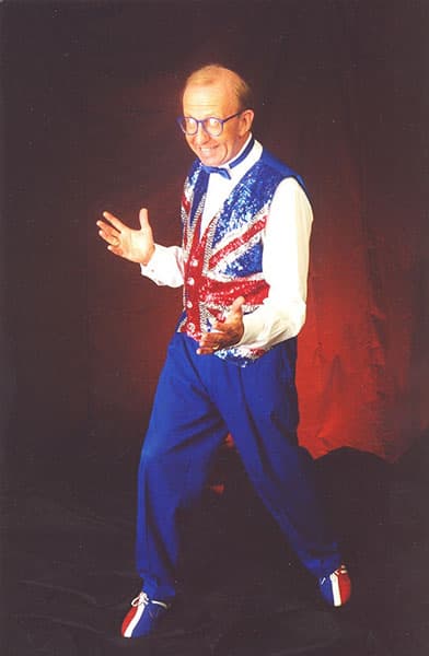 Jimmy Keys in a sequined vest on stage